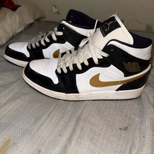 Nike Black and White Sneakers with Gold Swoosh